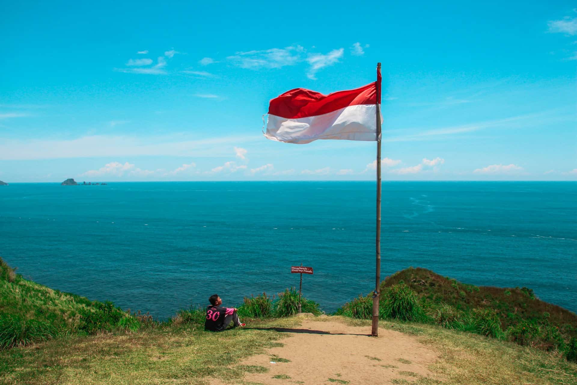 Indonesian flag by a beach