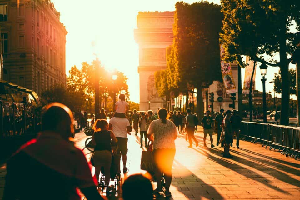 The sun sets over the Arc de Triomphe in Paris