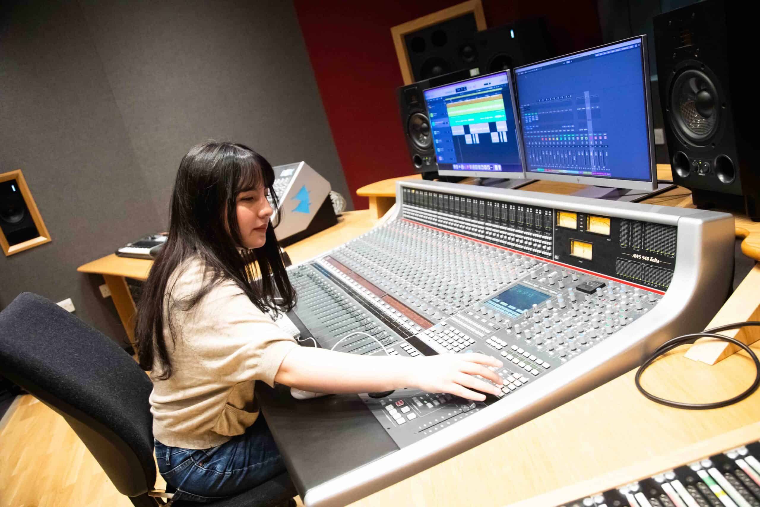 Victoria working in a music production studio