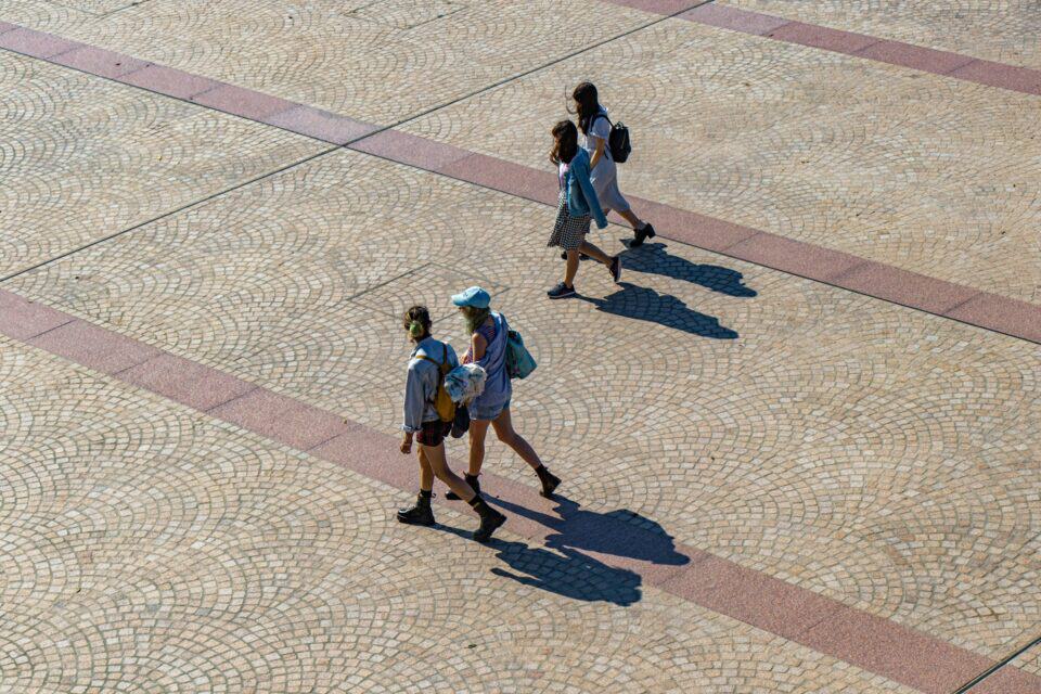People walk near Sydney Opera House