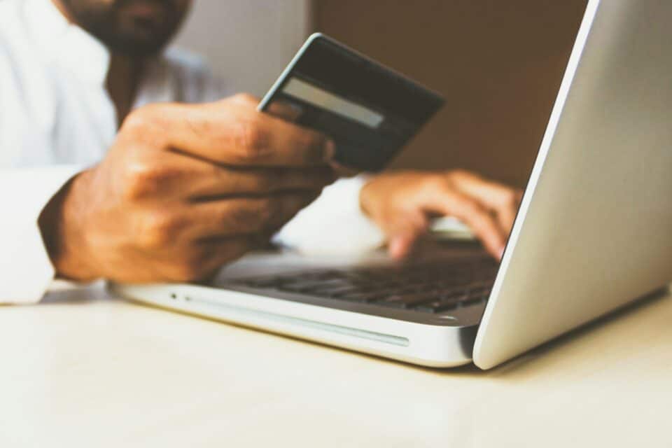 Man making online payment on laptop.