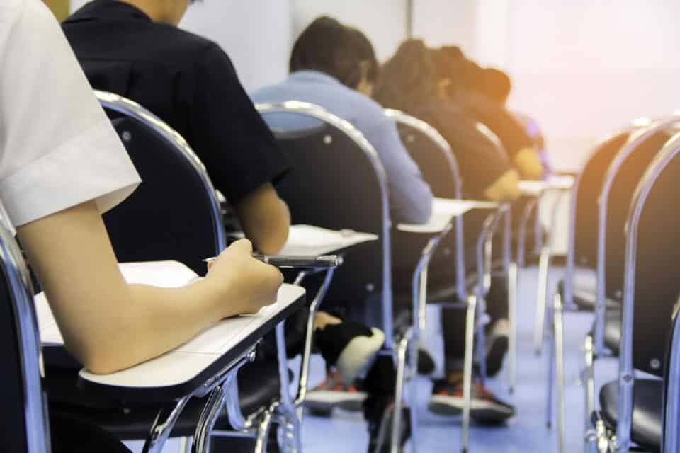 Test takers in an examination hall.