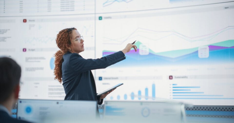 Woman giving data presentation.