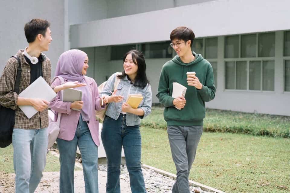 International students walking on university campus.